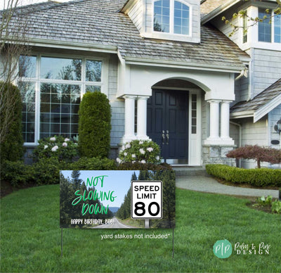 not slowing down birthday yard banner for adult male in front of house