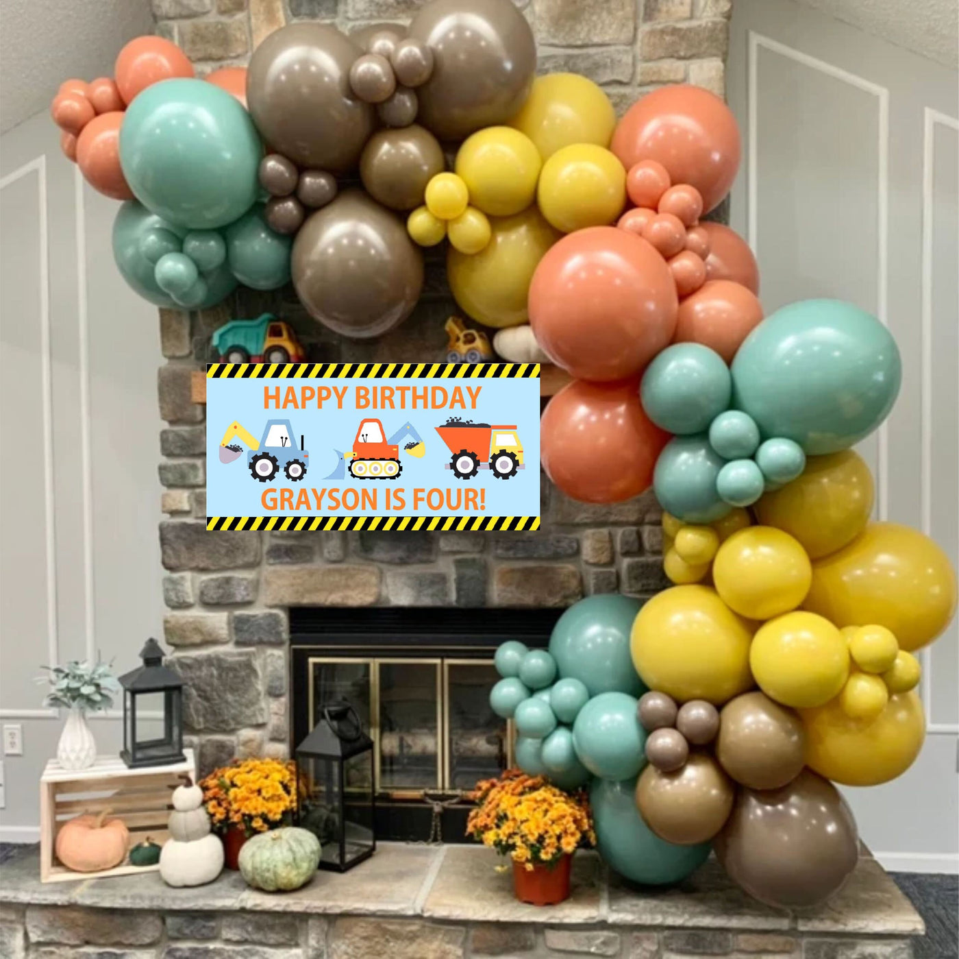 boys construction birthday banner in yellow, orange and blue with balloon garland