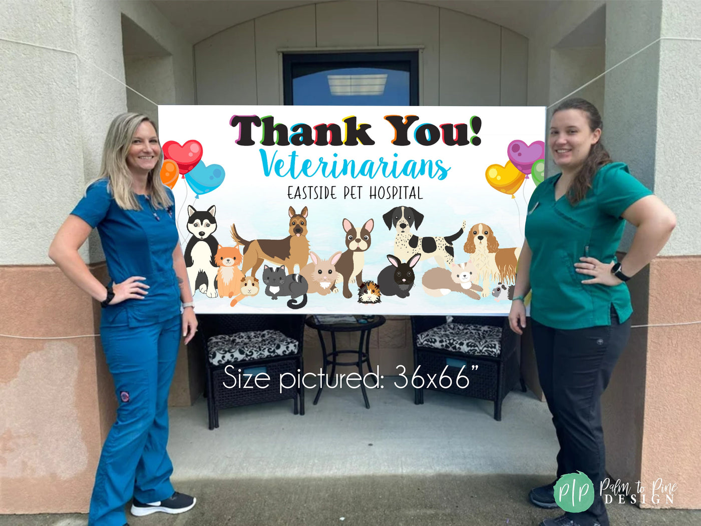 Veterinarians standing in front of appreciation banner for Veterinary Appreciation Day