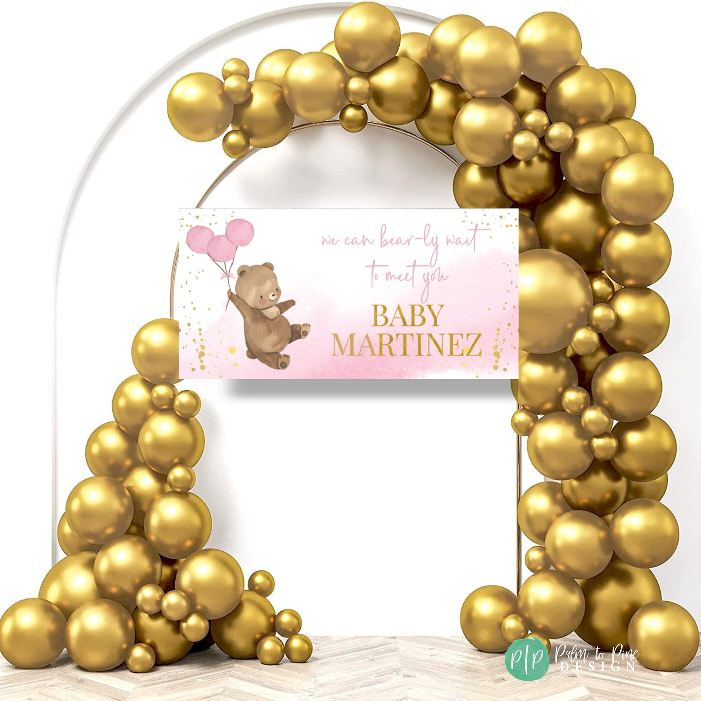 teddy bear baby shower theme with pink and gold balloon garland and personalized banner