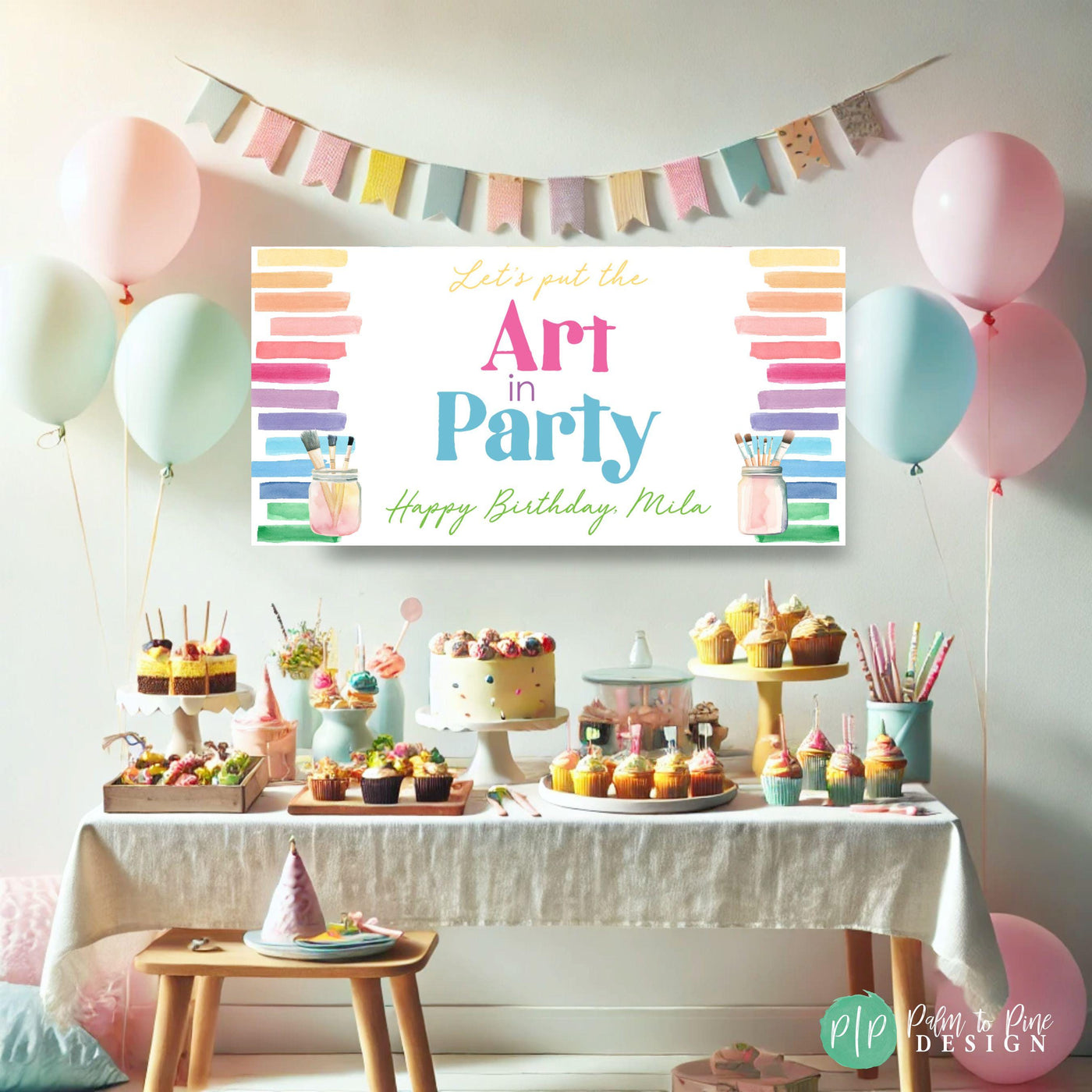 colorful art birthday party dessert table with personalized &quot;Art in Party&quot; birthday banner in rainbow watercolor designs