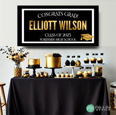 Modern graduation party banner featuring &quot;Congrats Grad,&quot; Class of 2025, student name, and school, with a sleek black and white border and gold accents in front of an elegant gold and black dessert table.