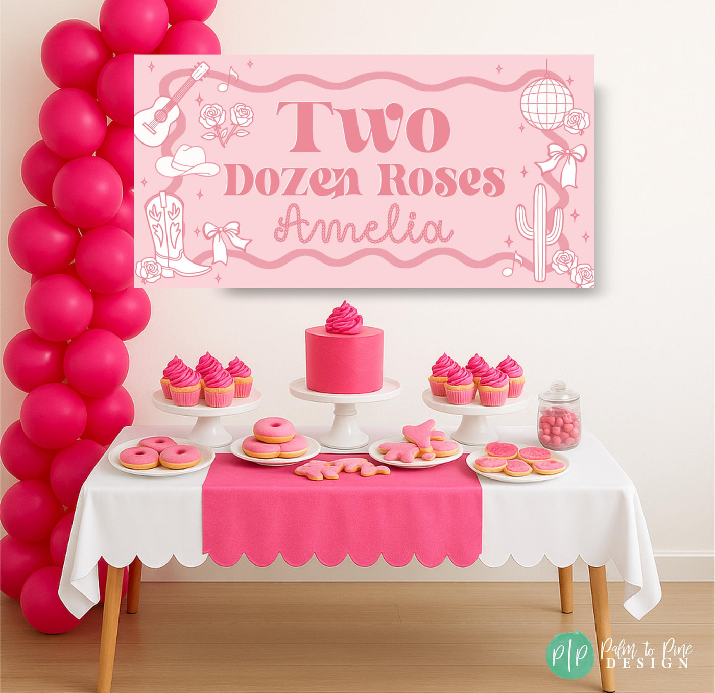 Two Dozen Roses party banner in front of pink dessert table