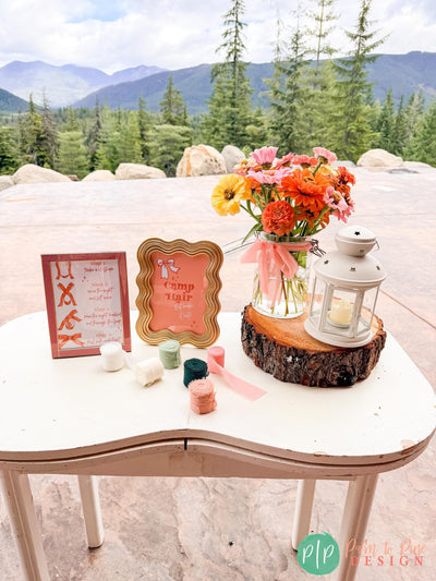 Hairbow making station at girls glamping birthday party with how to make a coquette bow printable sign, camp hair, but make it cute sign, hair ribbons and lantern